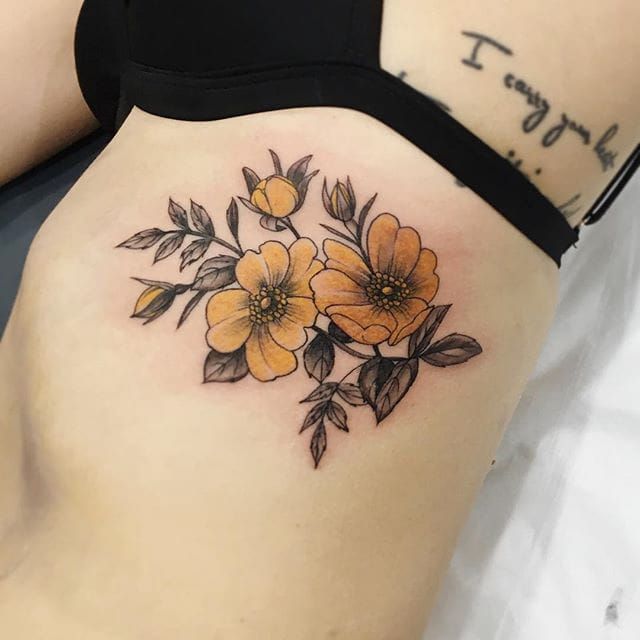 a woman's stomach with yellow flowers on it and the words i am sorry below