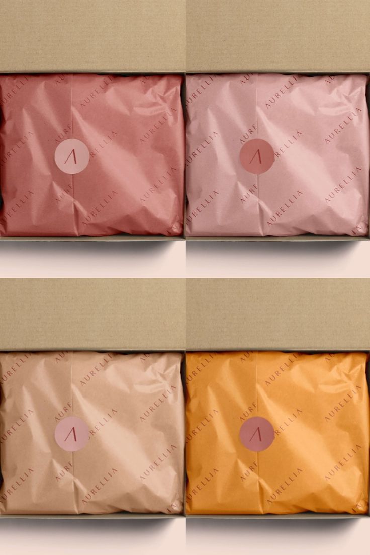 four different colored envelopes sitting on top of each other