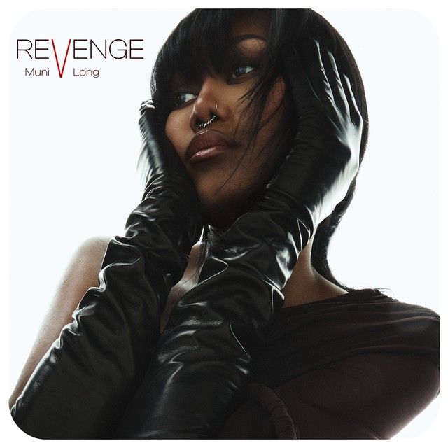 a woman wearing black leather gloves and holding her hands to her face with the words revenge on it