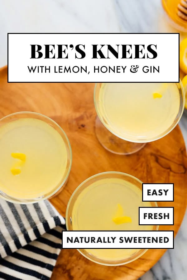 bee's knees with lemon, honey and gin on a wooden platter next to striped napkins