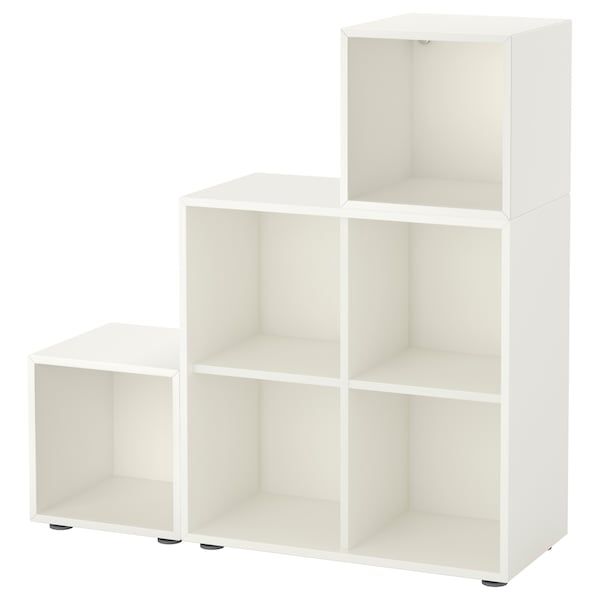 three white shelving units sitting side by side