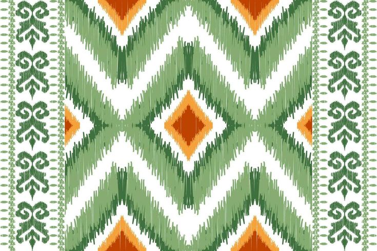 an abstract green and orange pattern on white fabric, with small diamonds in the center