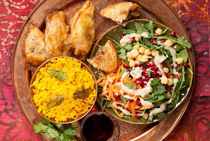 two plates of food on a wooden table