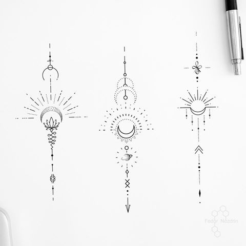 three different designs on a white paper next to a pen and ink drawing marker,