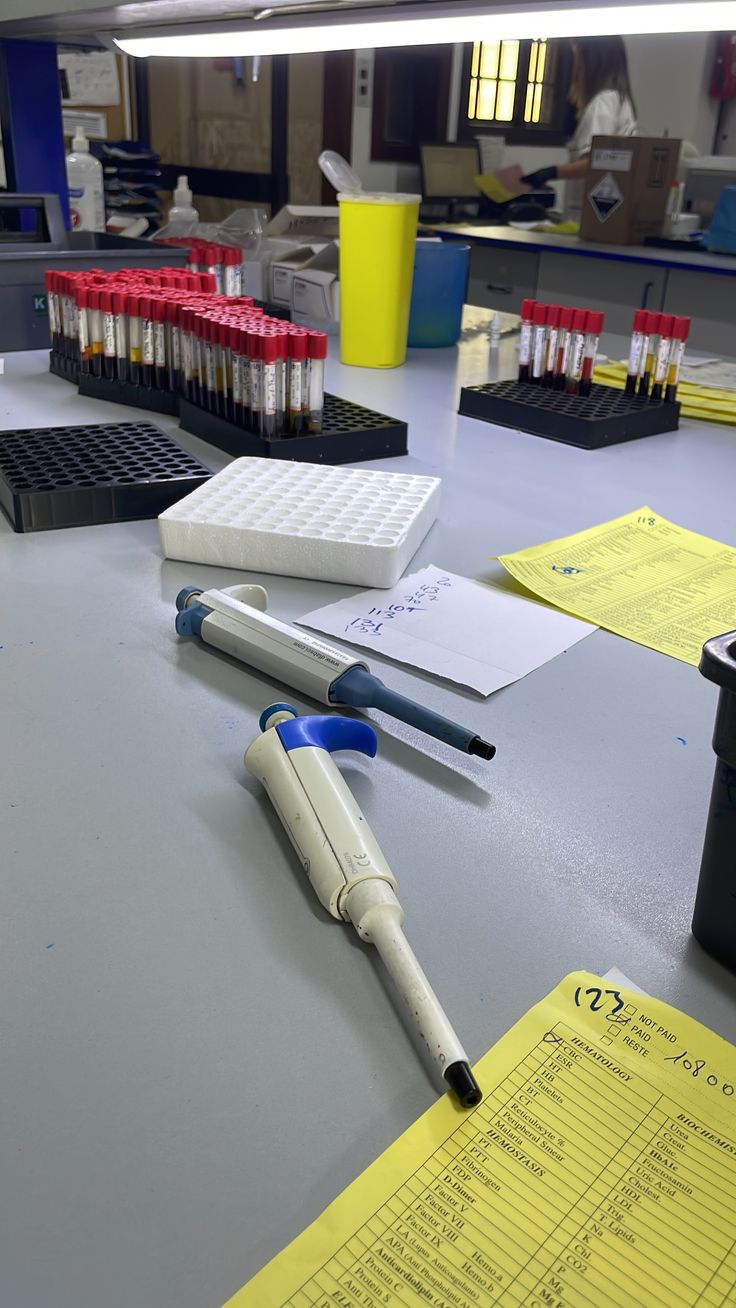 a desk with pens and papers on it