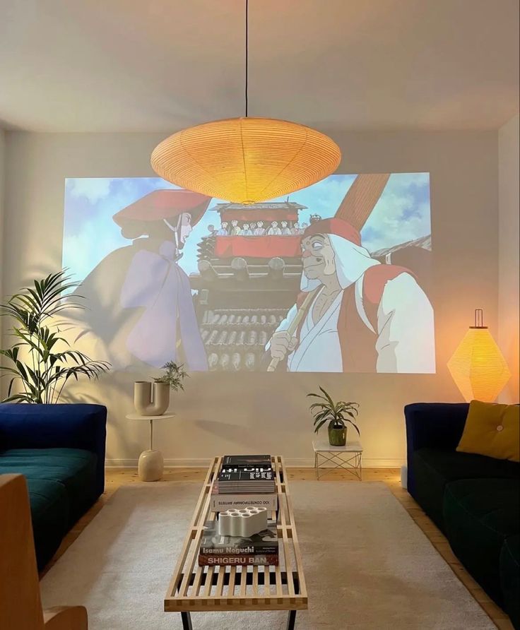 a living room filled with furniture and a projector screen