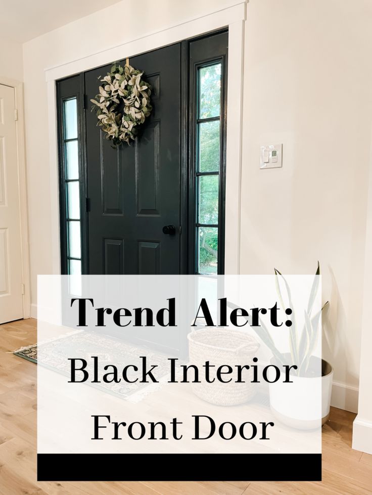 a black front door with the words trend alert black interior front door on it's side