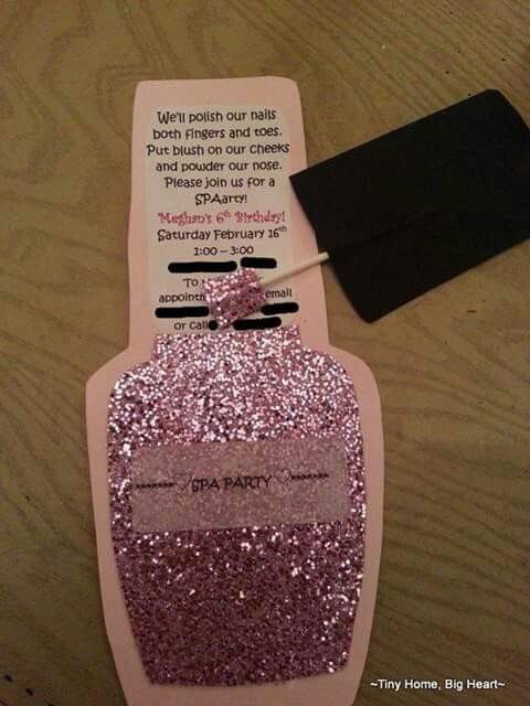 a pink and white box with some glitter on it next to a black piece of paper