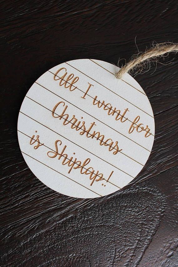 a wooden christmas ornament with writing on it that says, gift i want for christmas is shipping