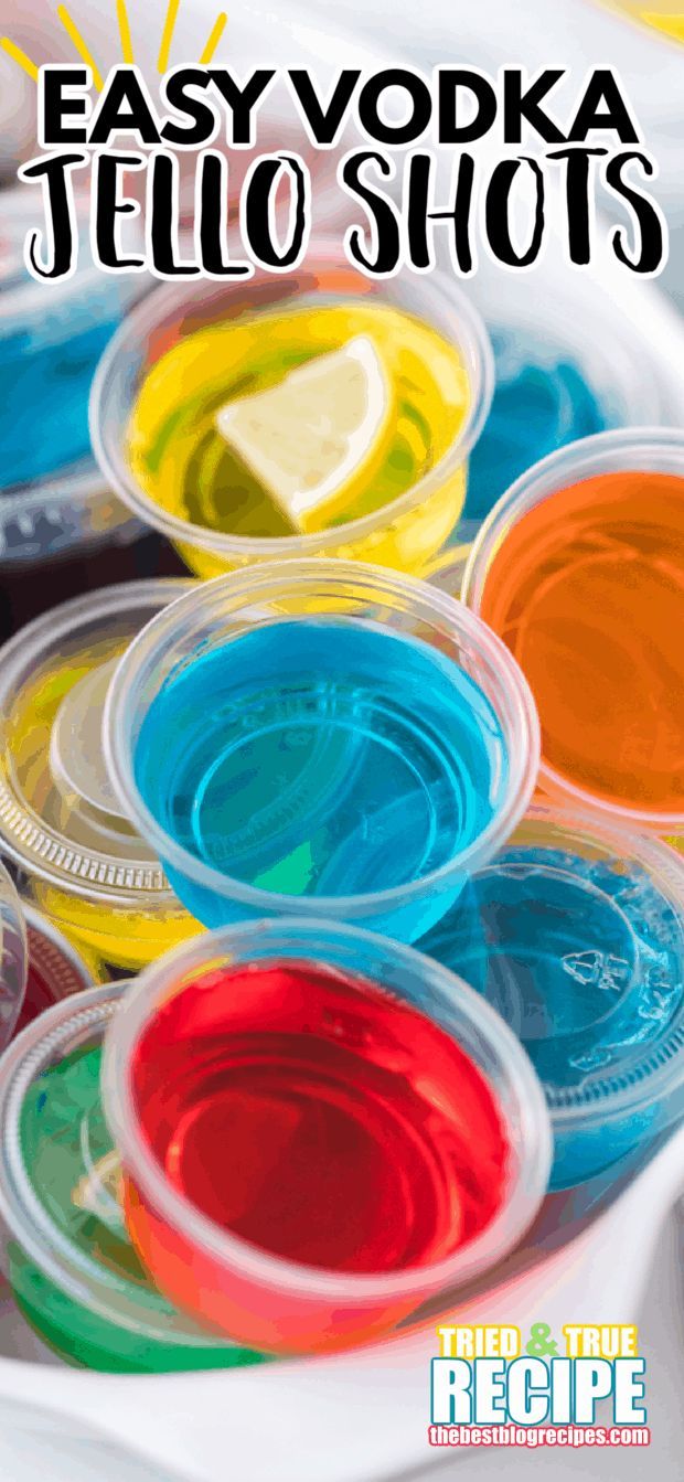 colorful jello shots in plastic cups with lemon wedges on top and text overlay that says easy vodka jello shots