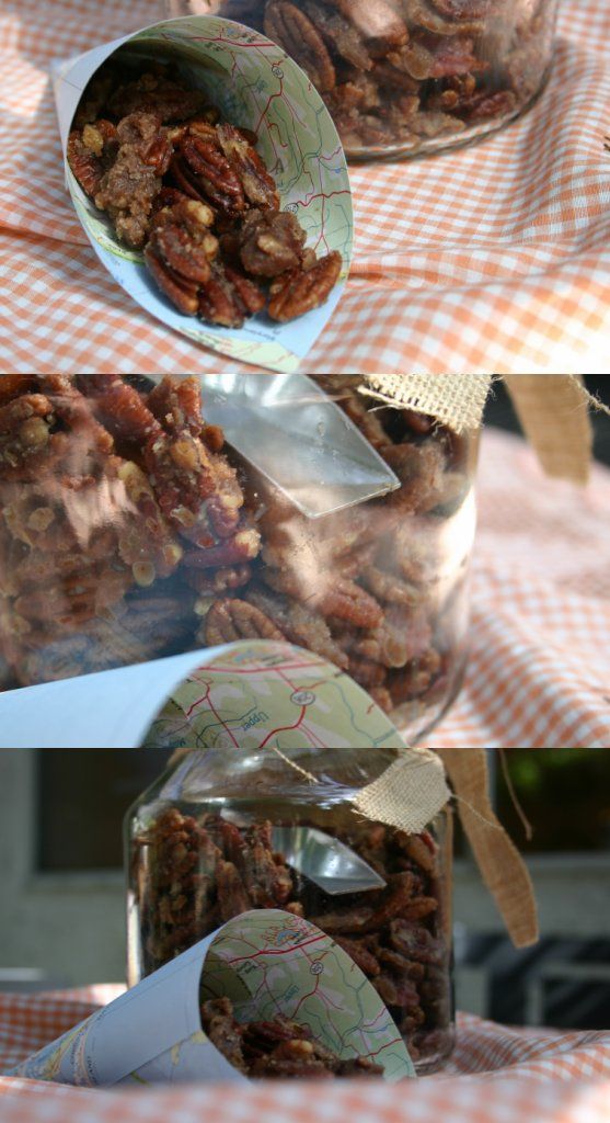 two jars filled with granola sitting on top of a checkered cloth covered table