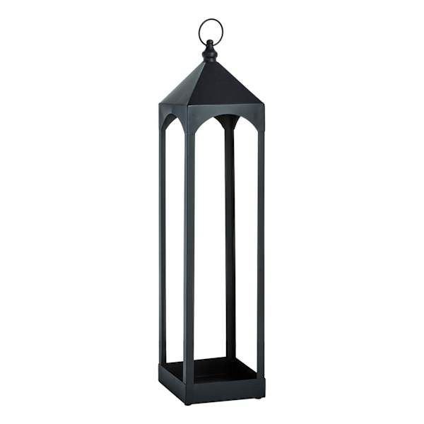 a black metal lantern with a candle holder on the top and bottom, in front of a white background