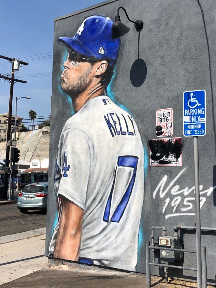 a painting of a baseball player on the side of a building