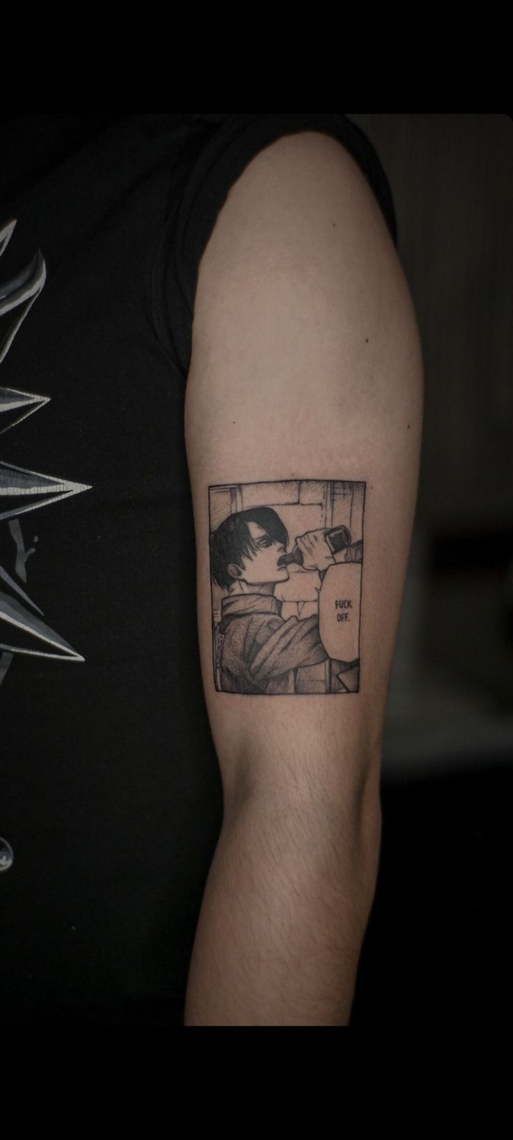 a man's arm with a tattoo on it that has an image of a person in