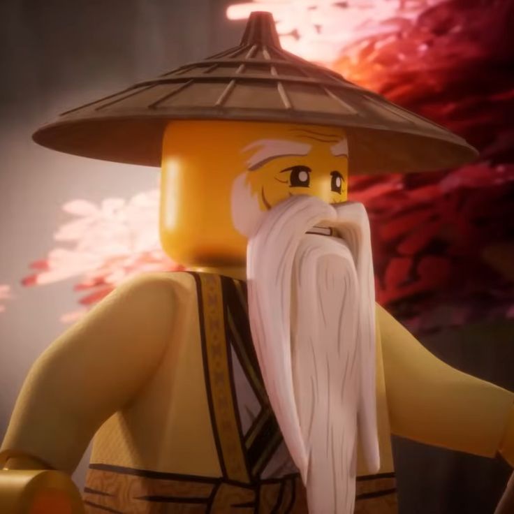 a lego man with a white beard and long white hair wearing a hat on top of his head