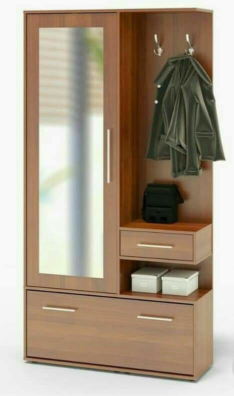 a closet with a mirror, coat rack and drawers