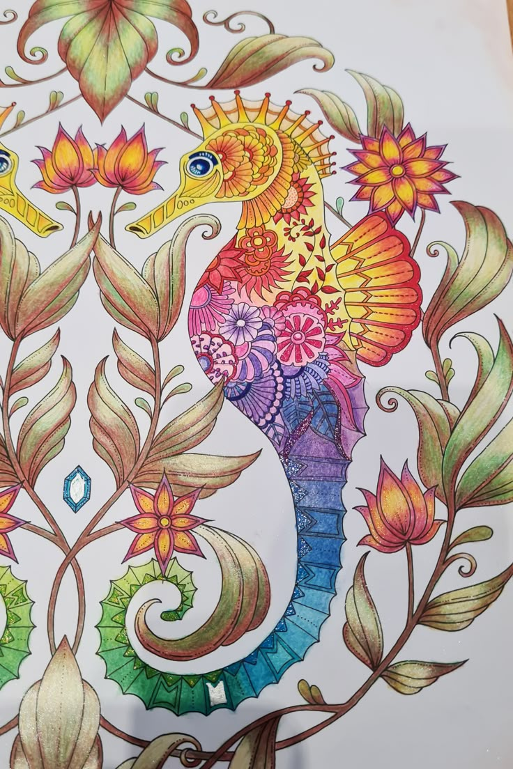 a drawing of a colorful sea horse surrounded by leaves and flowers