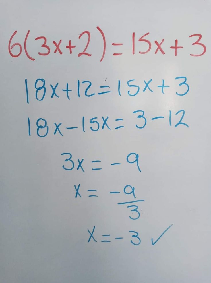 a close up of a white board with writing on it and numbers written in blue