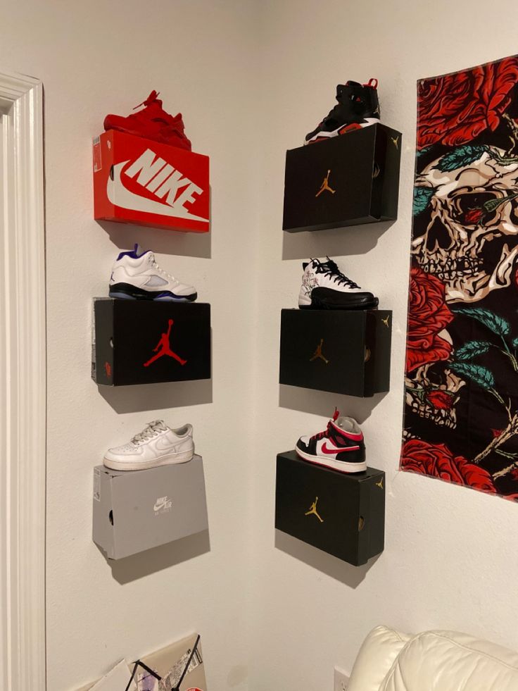 the wall is filled with nike shoes and other items that are hanging on the wall