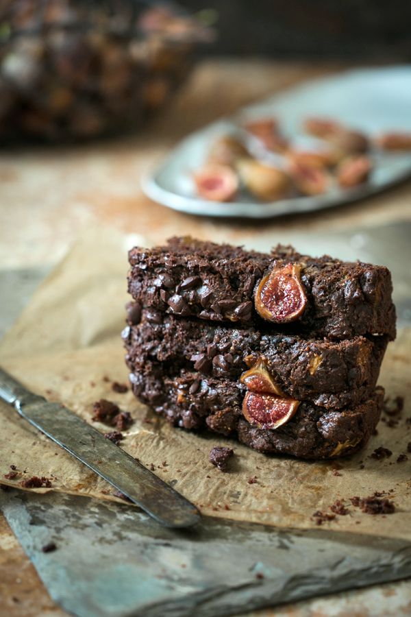 two pieces of brownie sitting on top of a cutting board