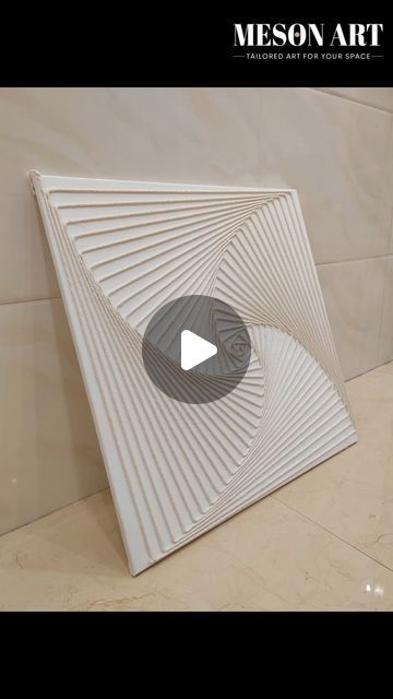 a white sculpture sitting on top of a tiled floor