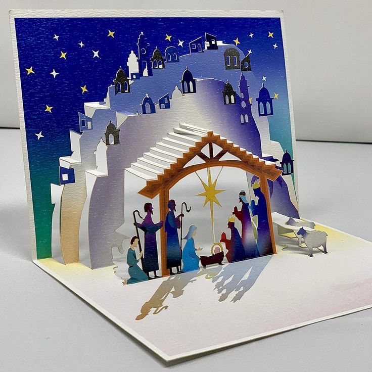 a christmas card with an image of the birth of jesus and three wise men on it