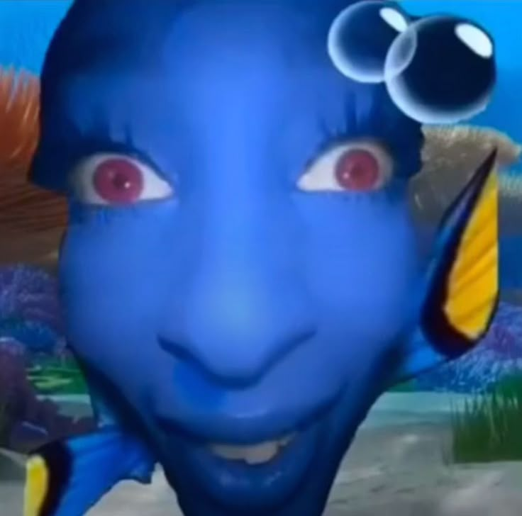 a blue man with red eyes and an orange fish on his head is looking at the camera