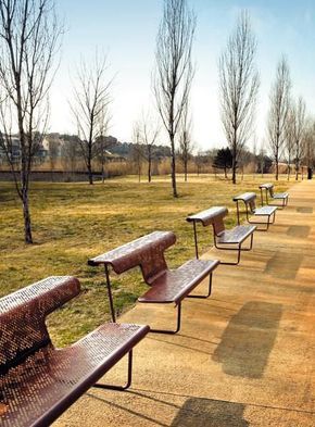 there are many benches lined up in the park