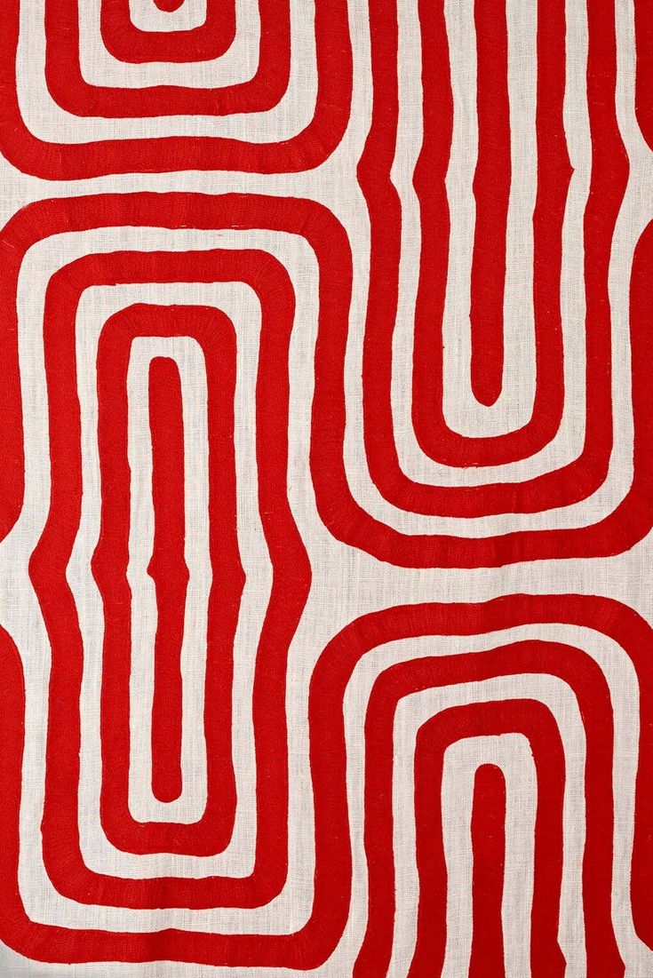 red and white fabric with wavy lines on it