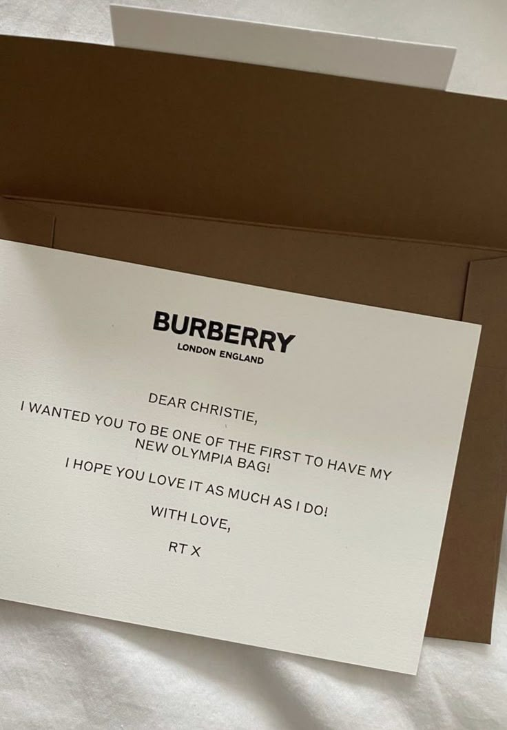 there is a card that says burberry on the front and back of it