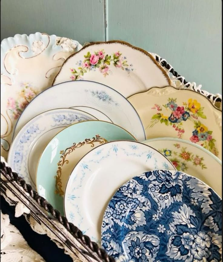 a bunch of plates that are in a basket