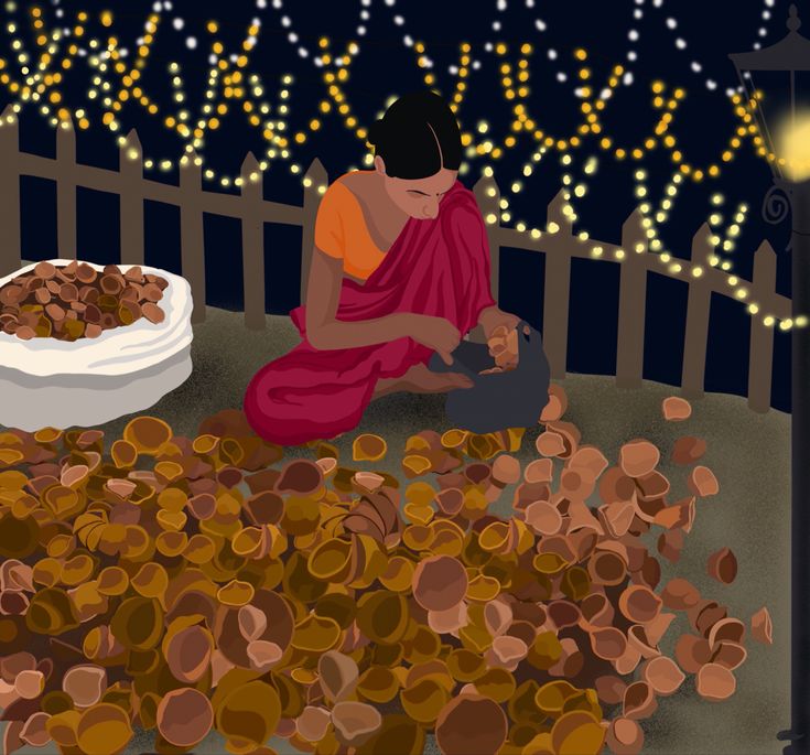 a woman sitting on the ground next to a pile of wood chips and a bowl of nuts