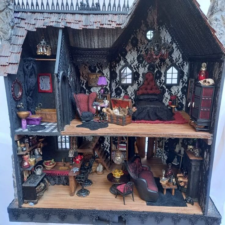 a doll house with furniture and accessories inside