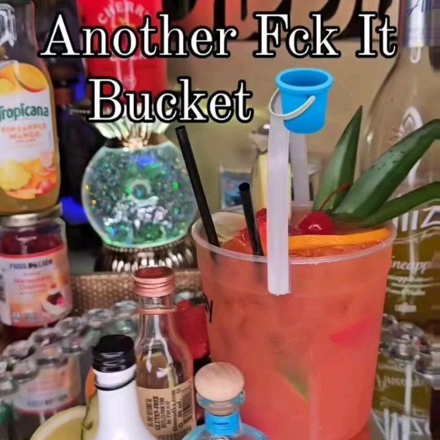 an assortment of liquors and drinks on a table with the words another f k it bucket