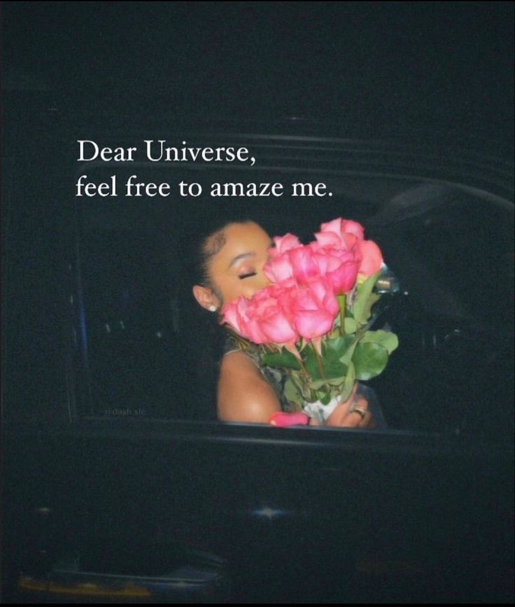 a woman holding a bouquet of roses in her hand with the words dear universe, feel free to amaze me