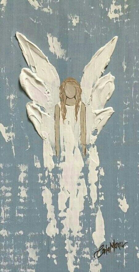 an angel painted on the side of a blue wall with white paint and water droplets