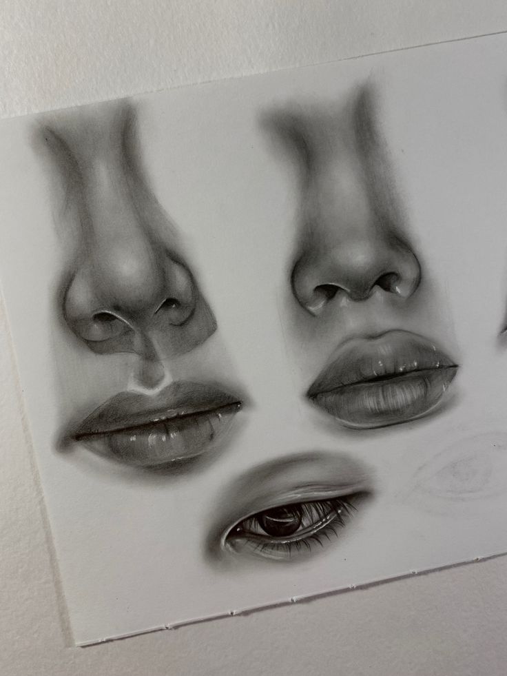 a drawing of three different faces with their eyes closed and one being drawn in pencil