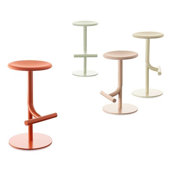 three different colored stools sitting next to each other