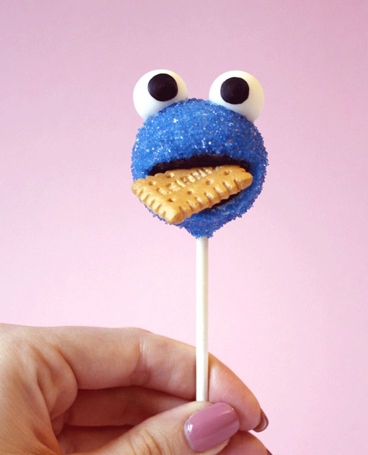 a cookie monster lollipop on a stick with eyes