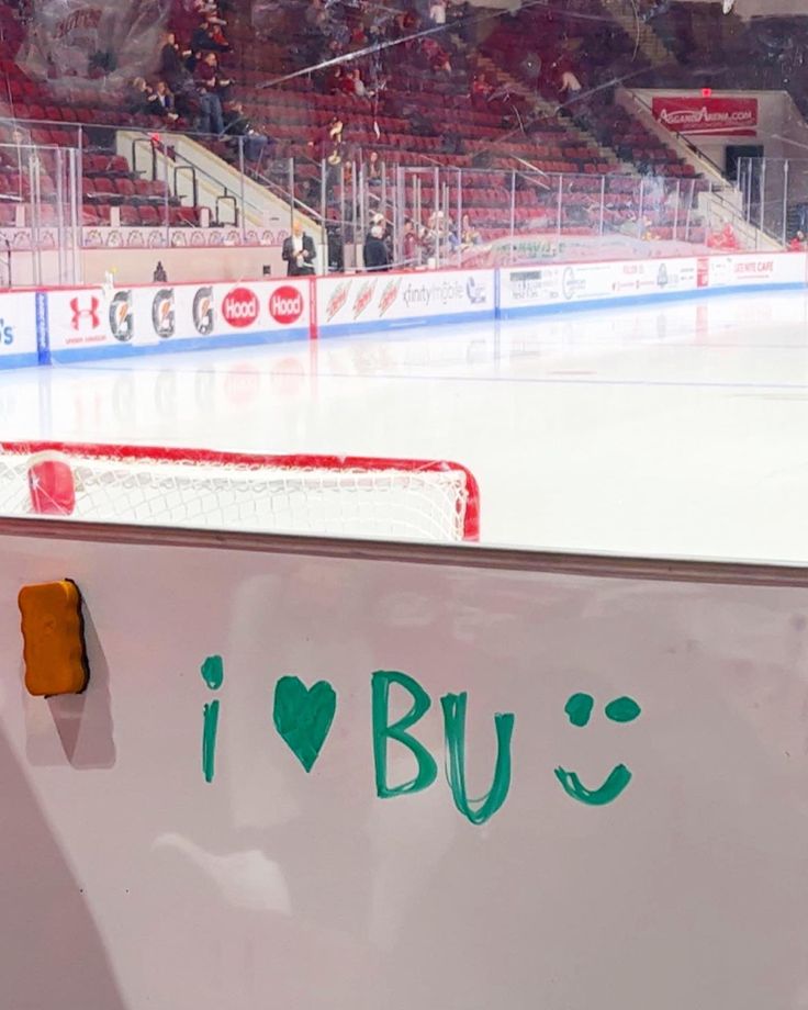 an ice hockey rink with the words i love bus written on it