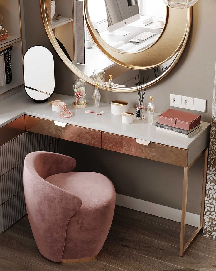 a vanity with a mirror and stool in front of it