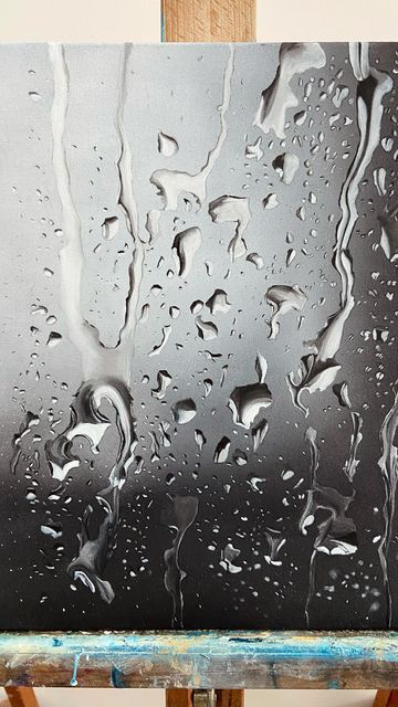 an easel with water drops on it