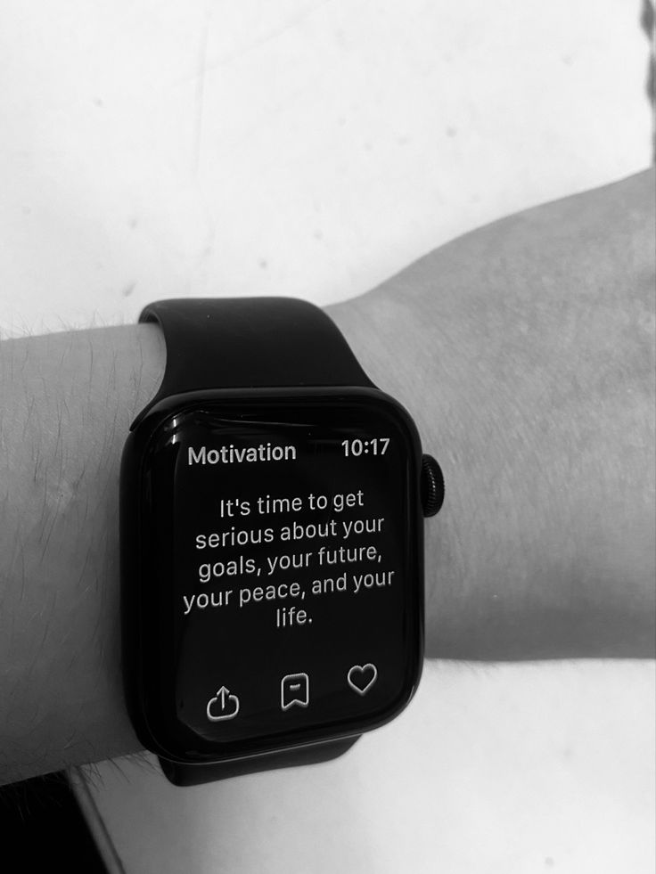 a black and white photo of an apple watch on someone's wrist