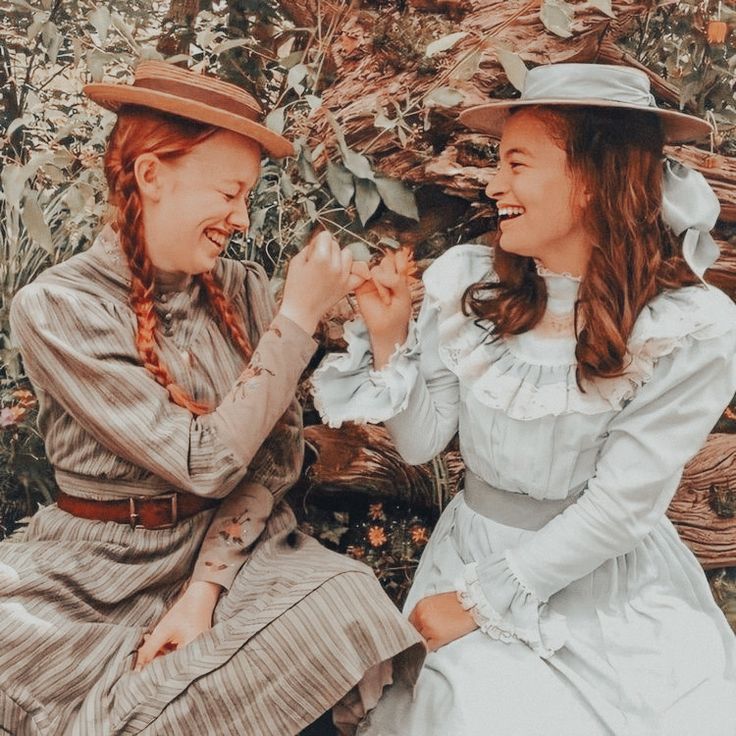 two young women sitting next to each other