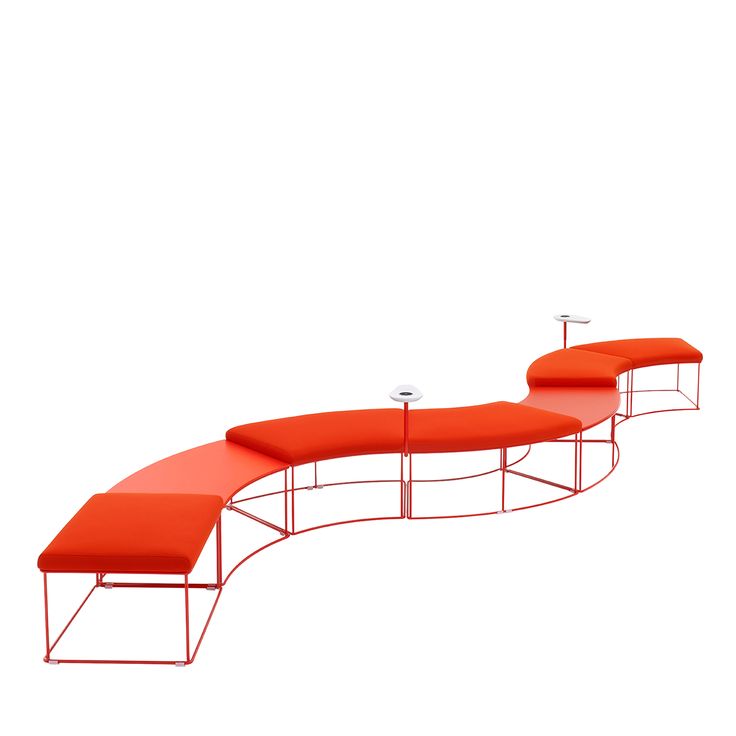 an orange bench sitting on top of a white floor