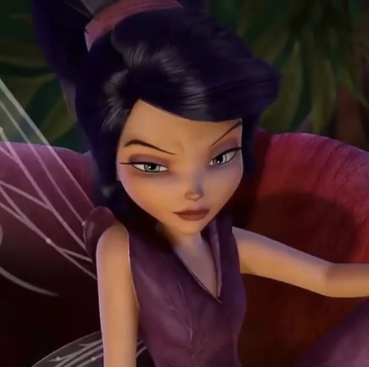 the animated tinkerbell fairy is sitting in a chair with her hand on her hip