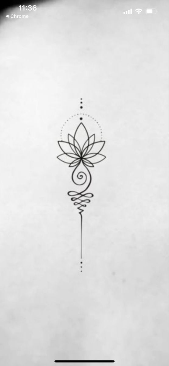 a black and white photo of a flower tattoo