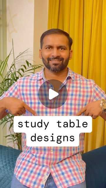 a man standing in front of a couch with his hands on his hips and the words study table designs above him