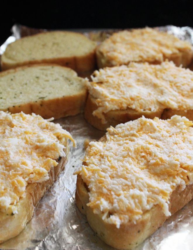 several pieces of bread sitting on top of tin foil