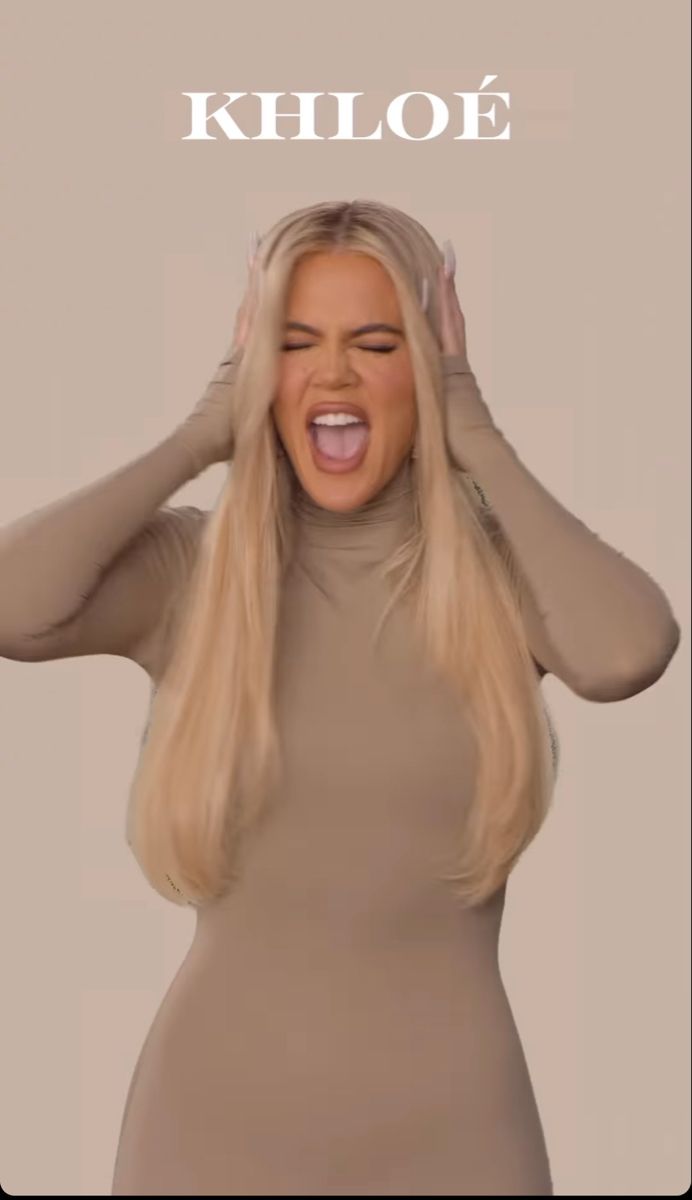 a woman with long blonde hair is holding her hands up to her head and the words khloe above her head